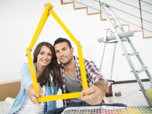 couple in new home choosing wall paint colors